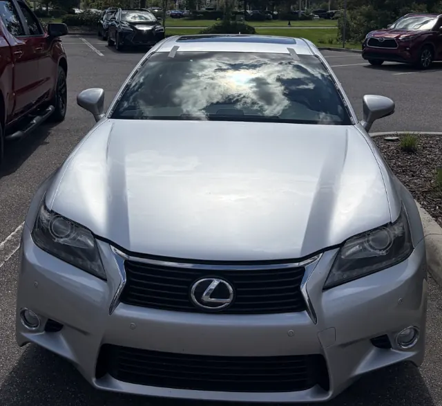Front view of a silver Lexus GS sedan in a parking lot